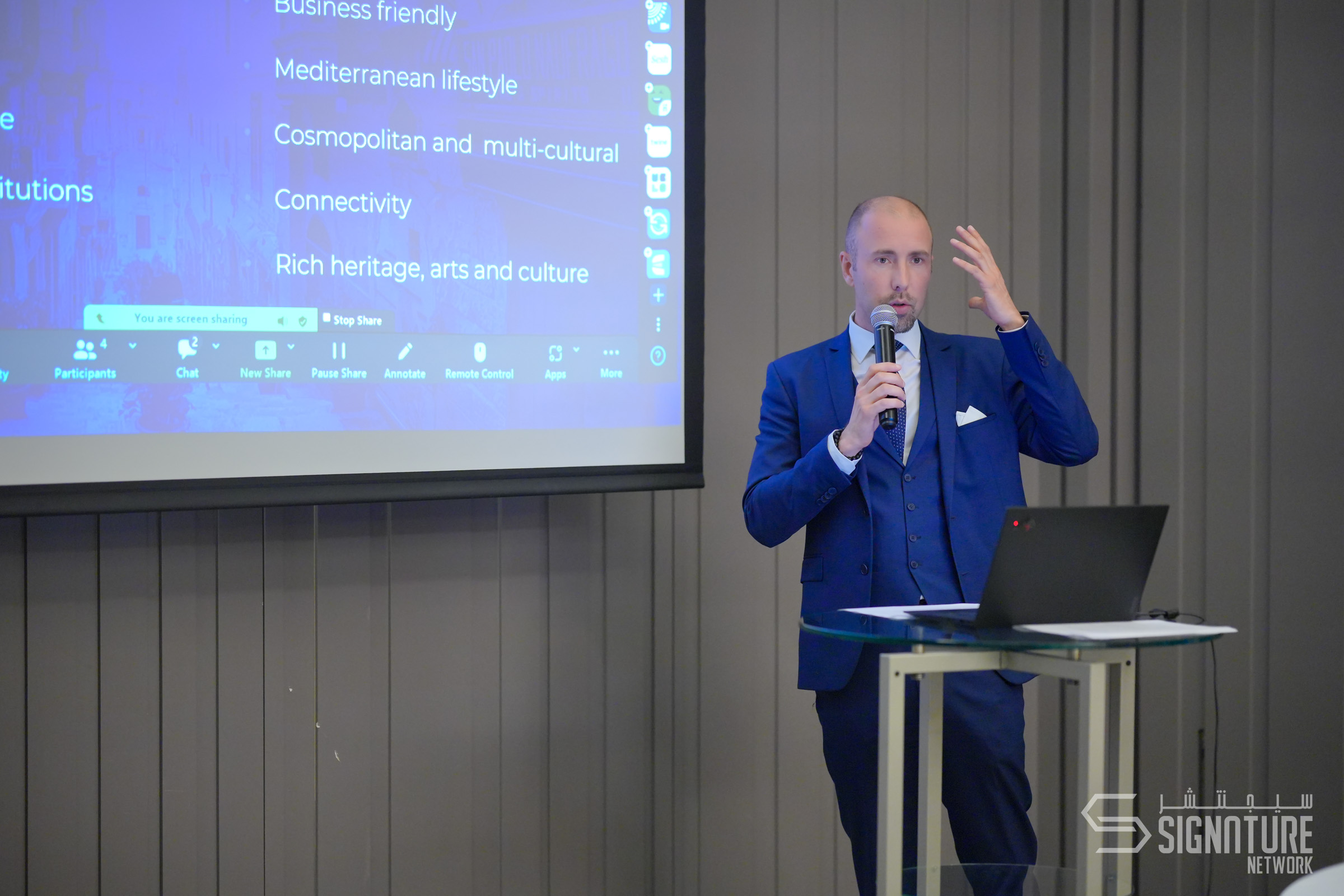 Marc Ménard speaking with a microphone