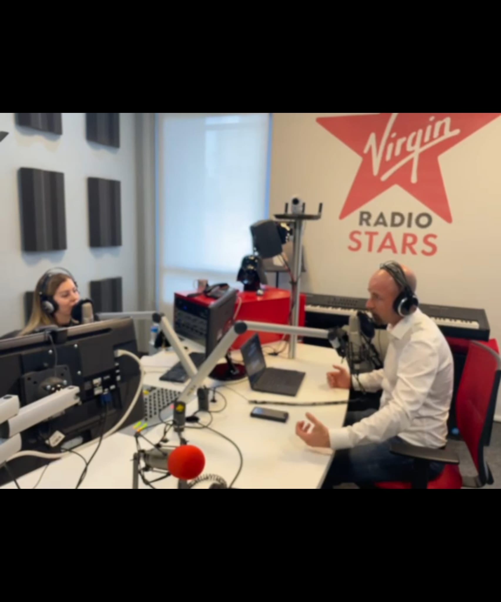 Marc Ménard speaking in a radio studio