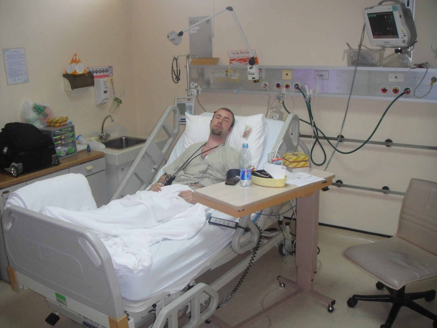 Marc in a Bangkok hospital room
